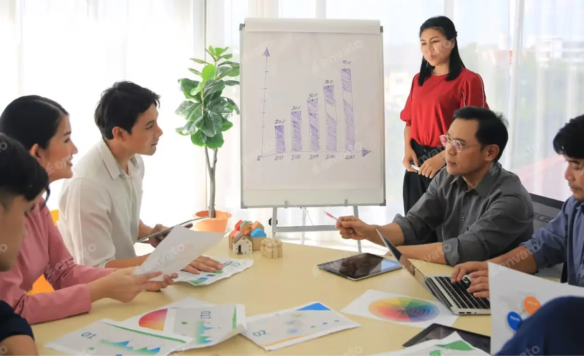 Team discussing growth chart in a business meeting